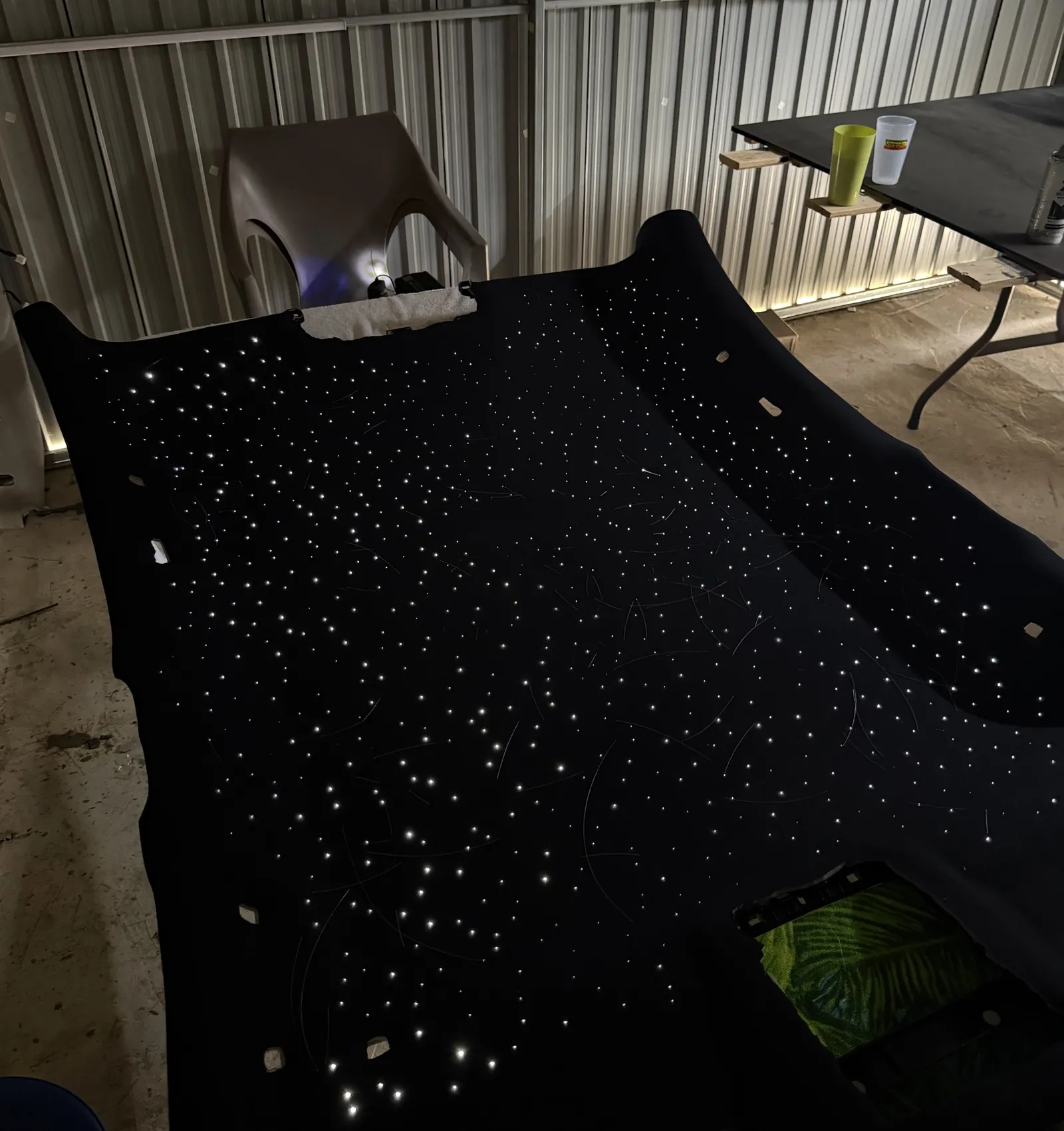 A headliner out of the car on the bench with its fibre-optic stars lit