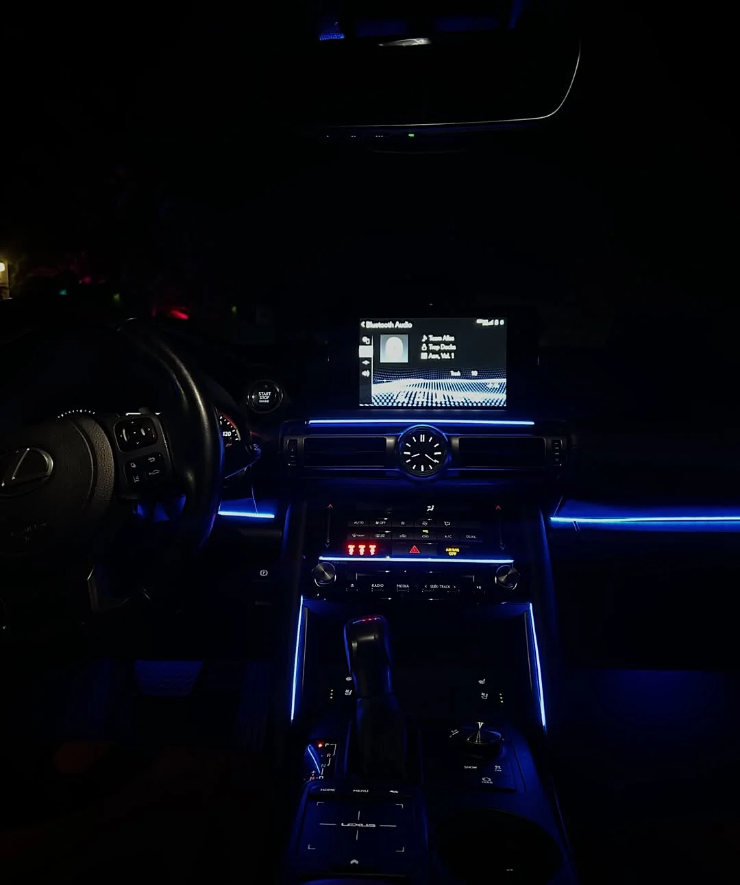 A single ambient light line running along a Lexus dashboard
