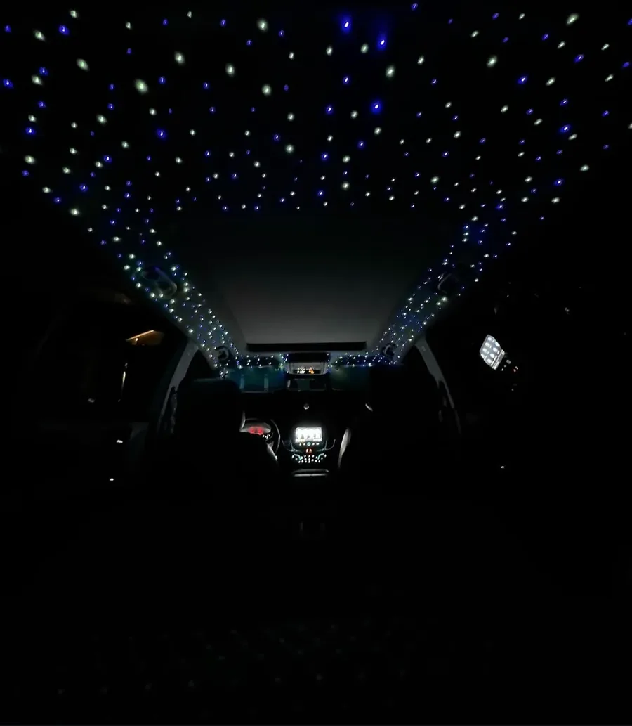 Dense starlight headliner arching over a whole cabin