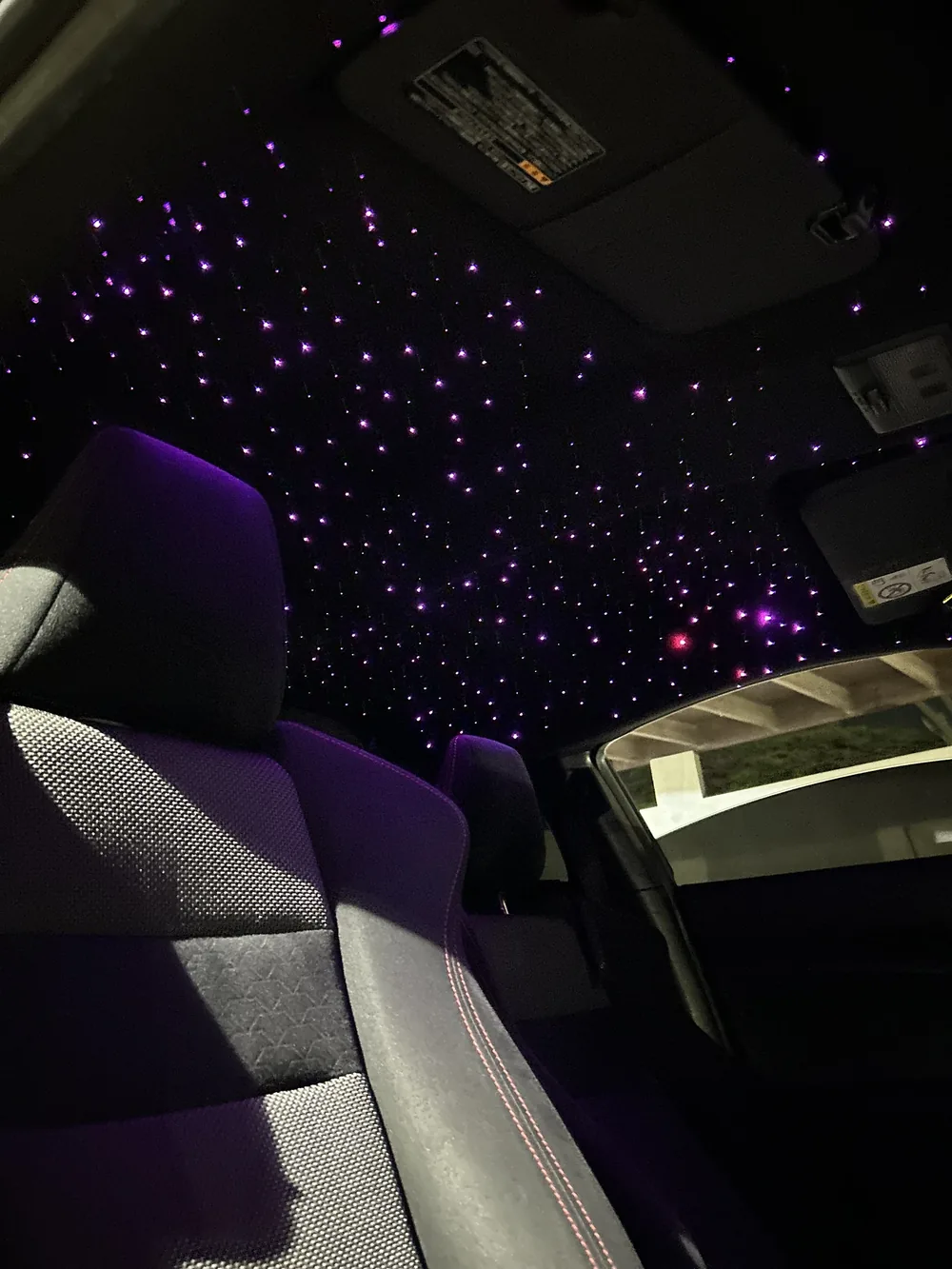 Dual-colour fibre-optic starlight headliner installed in a client's car
